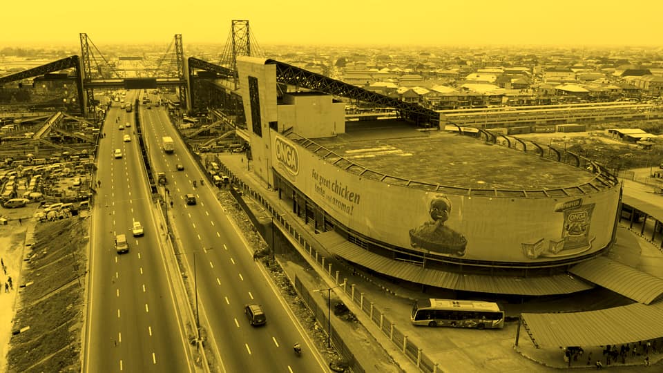 Aerial view of the expressway beside the National Stadium in Surulere with a blue BRT bus