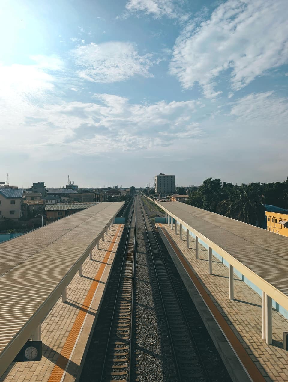 Aerial view of railway tracks and a platform at Oworonshoki